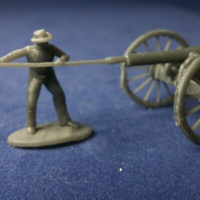 Confederate cannoneer in hat loading cannon